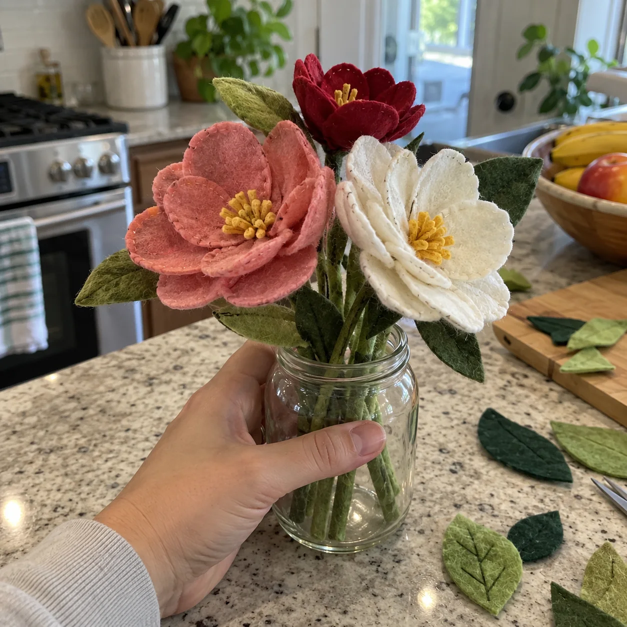 Handmade felt flowers held in a jar at home