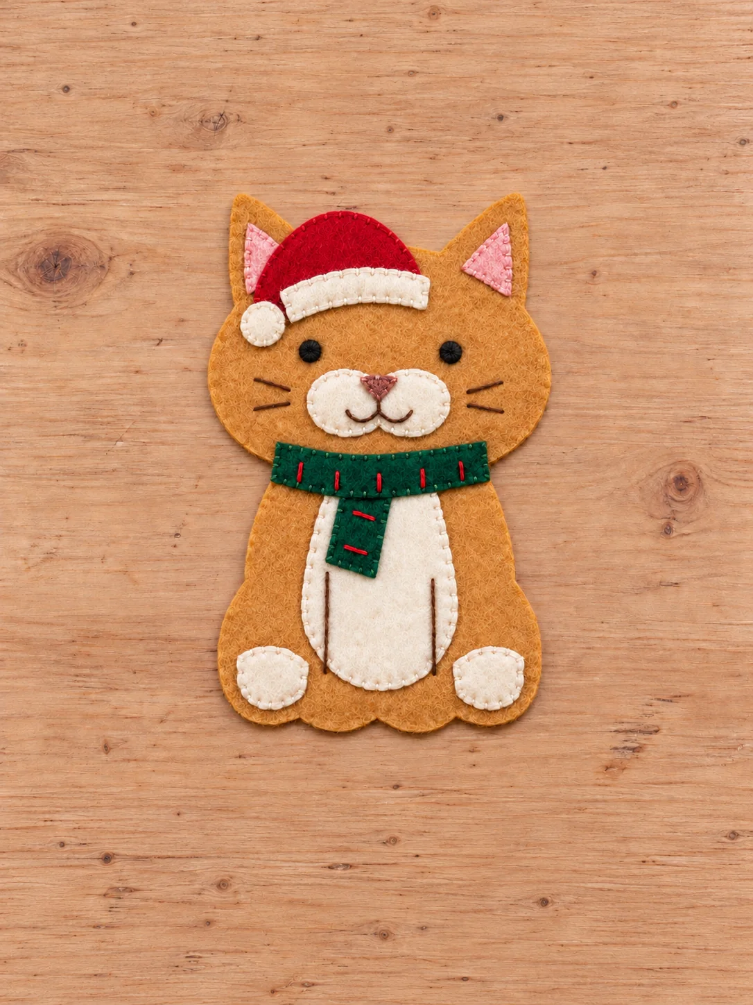 Felt cat front with red Santa hat ivory brim and green scarf sewn in place