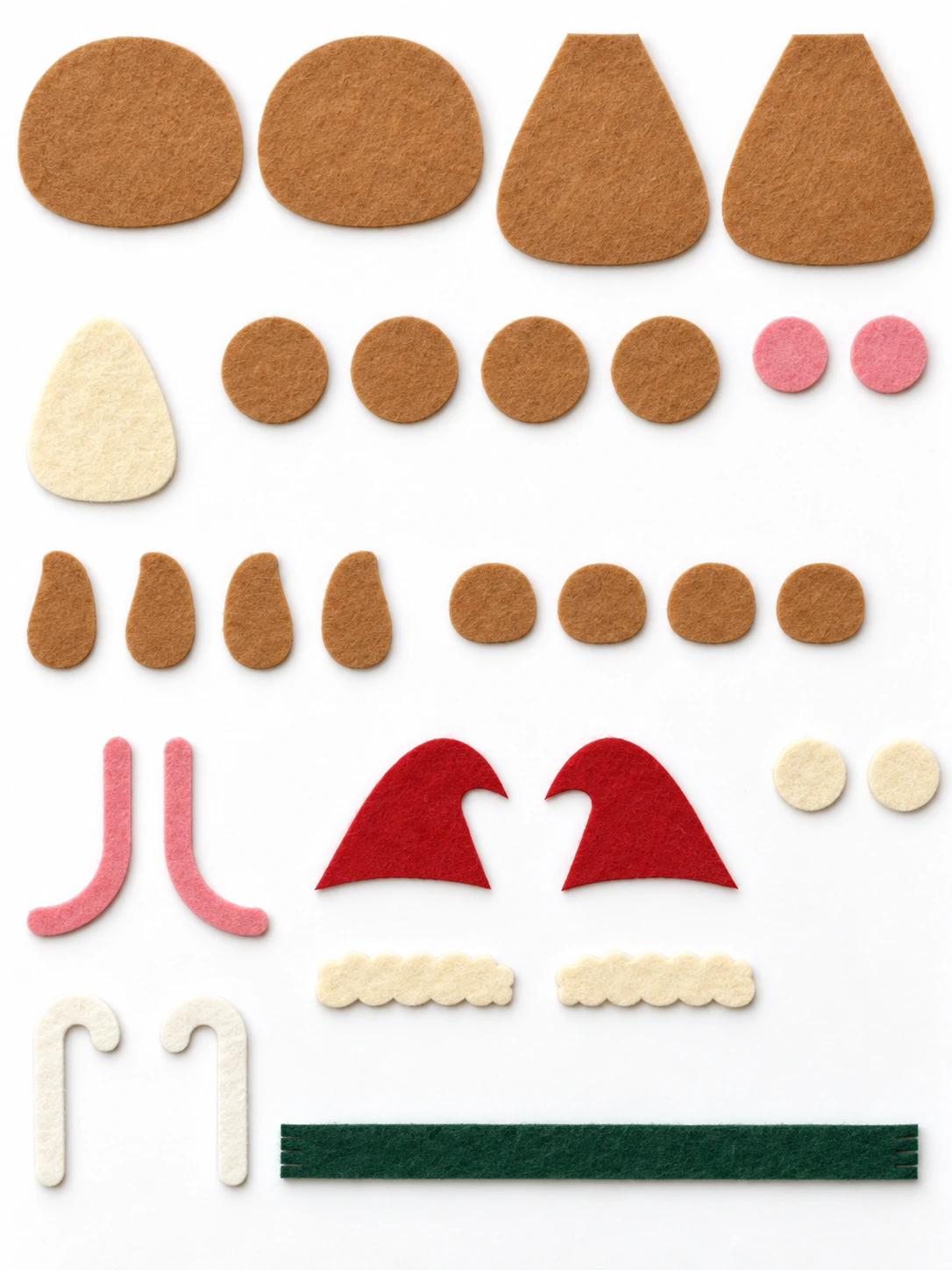 All 30 cut felt pieces for the Christmas mouse, including four feet, two white candy canes and one green scarf