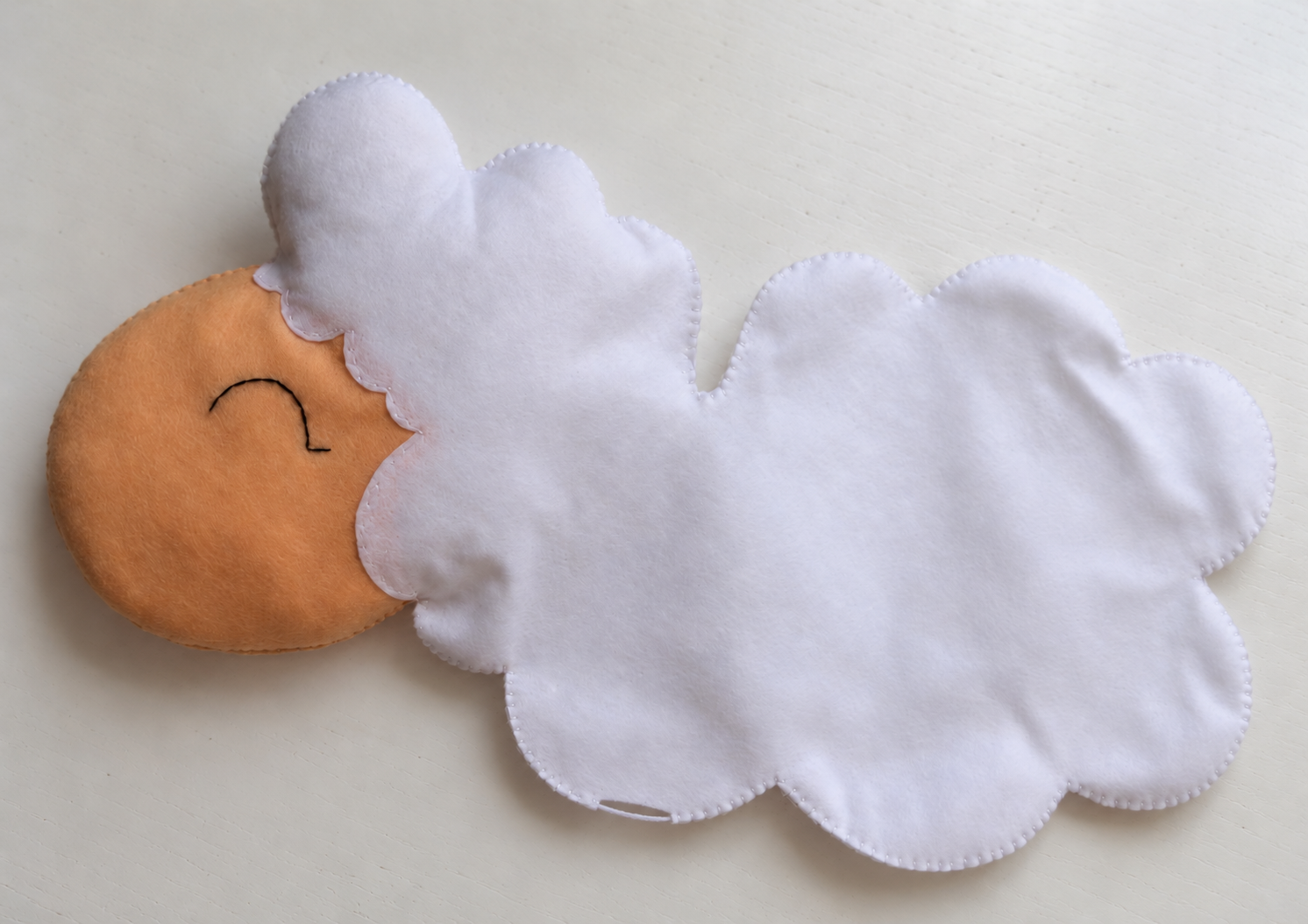 Most of the sheep body sewn with a small stuffing opening remaining