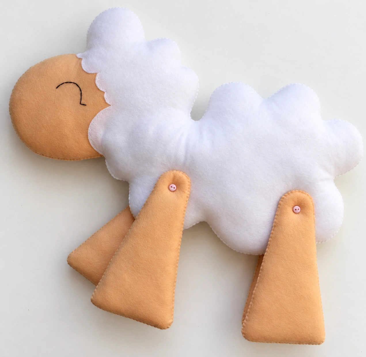 The sheep with all four beige legs attached using button joints