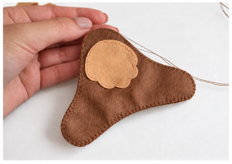 Body blanket stitched around the edge with a stuffing opening left